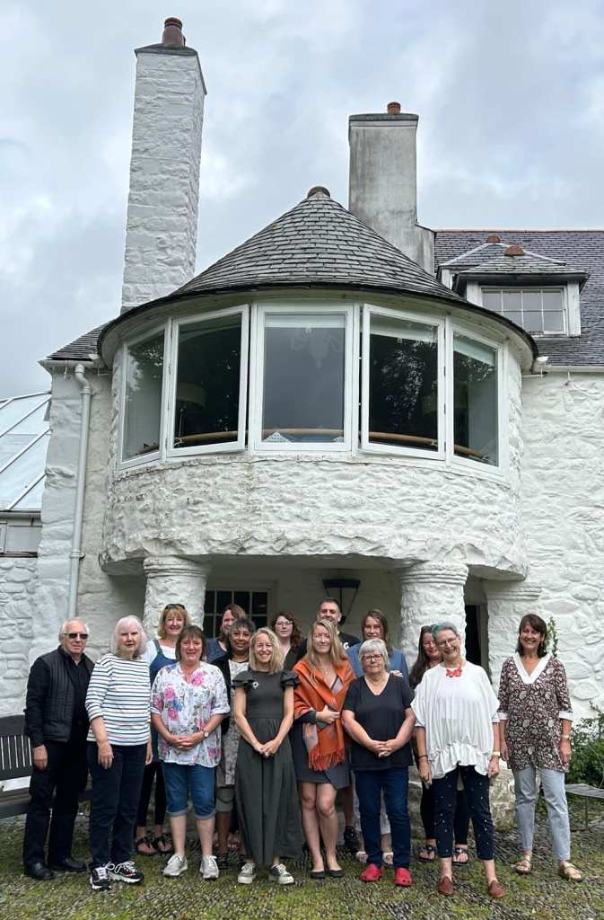 Lovely group at Ty Newydd - pic shows the group lined up around the back of the house - a big bay window above and white chimneys