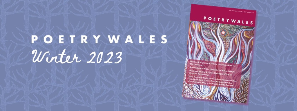 The magenta cover of 59.2 against a background of blue tree silhouettes and the words Poetry Wales, Winter 2023.